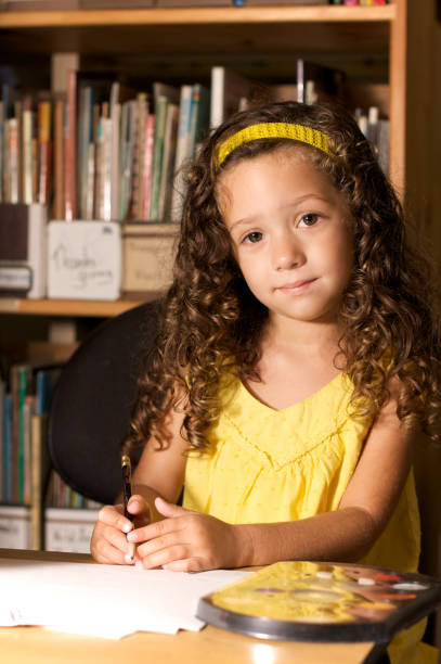 istock girl writing in the library 157482836