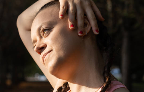 istock Athletic woman doing relaxing stretching exercises. stretching his neck before training 1574832791