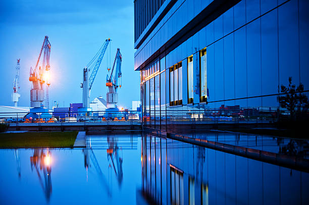 Modern Harbor Dockyard with Ship and Cranes at Hamburg Harbor crane machinery photos stock pictures, royalty-free photos & images