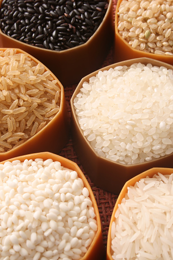 Plastic containers holding different types of rice