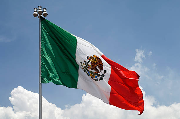 Flag of Mexico with blue sky stock photo