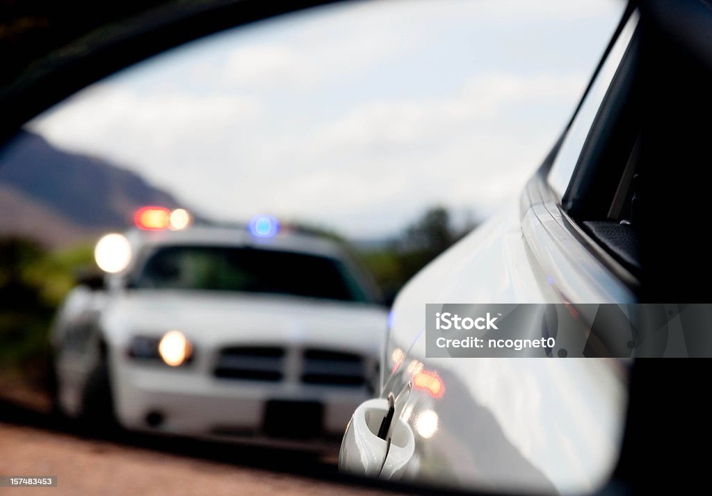 Pulled over by the Police in blurred Dodge Charger  Police Force Stock Photo