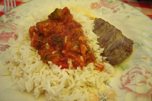 istock Hash brown meat steak served with ratatouille and white rice 1574834980