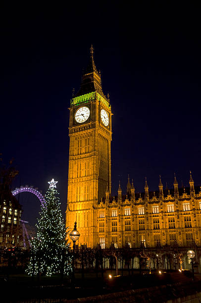 istock Big Ben in London with Christmas tree at dusk 157483791