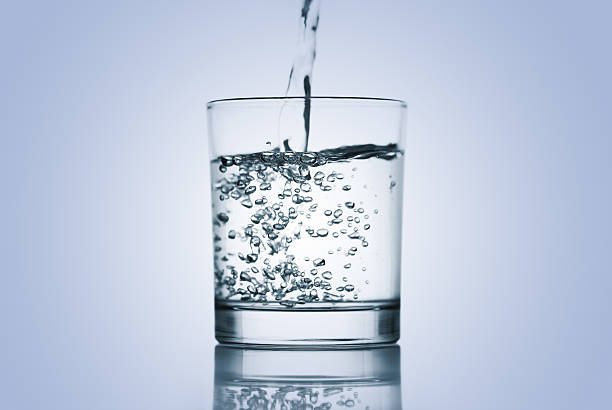 istock Pouring mineral water into a glass. 157483916