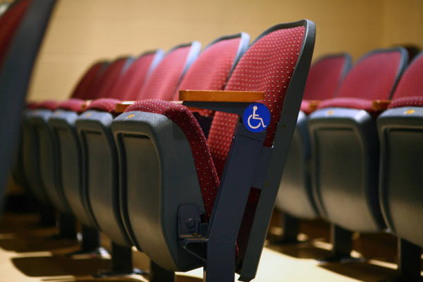Goiânia, Goias, Brazil – May 15, 2023:  A few rows of red armchairs in an empty theater.