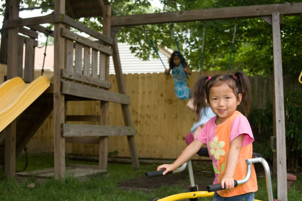 istock Cute girl using walker infront of swingset 157484058