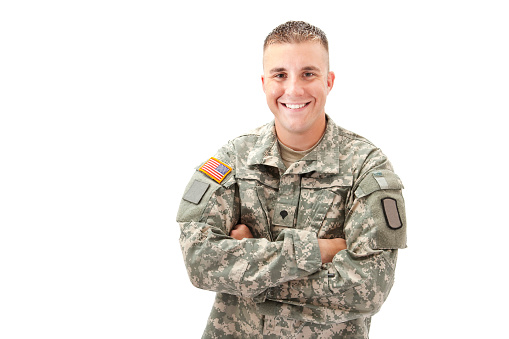 Half length photograph portrait of a handsome man in his United States military uniform; copy space 