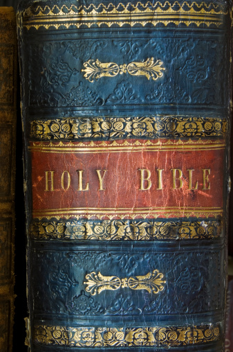 Close up of the spine of a leather bound antique bible