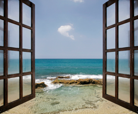 View of the ocean through opened windows.  Image is NOT interpolated, it is made up of 3 stitched images