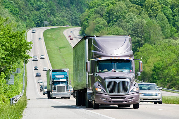 istock Heavy traffic on the interstate highway with green trees 157484559