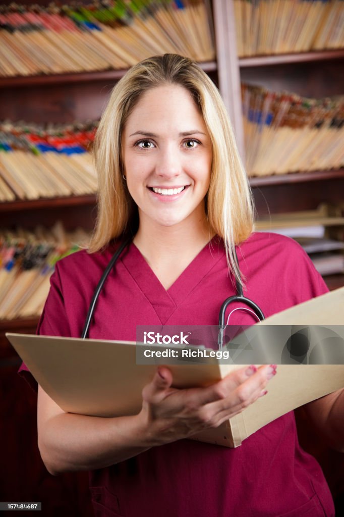Enfermeira no Consultório Médico - Foto de stock de Adulto royalty-free