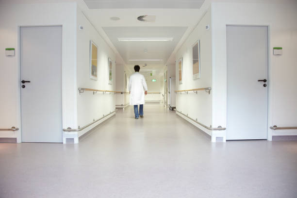 istock Doctor hurrying along a hospital floor 157484927