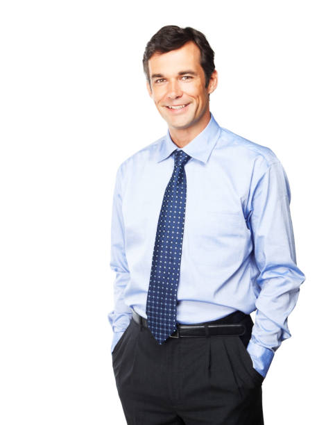 Happy mature businessman with his hands in pockets