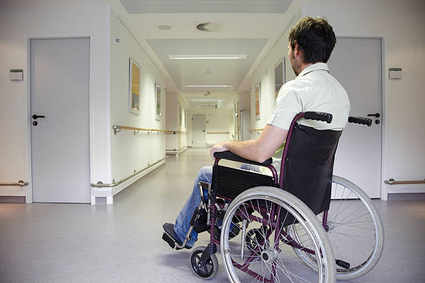 Man in a wheelchair stock photo