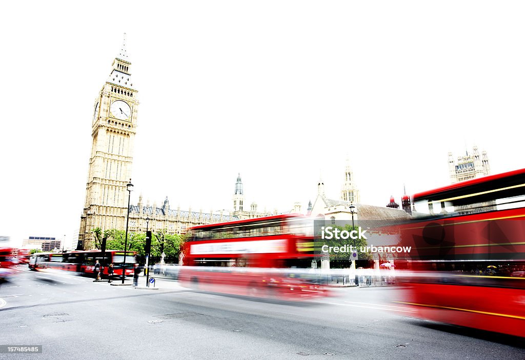 London buses at Westminster Motion blurs of London buses passing Big Ben during the day Big Ben Stock Photo