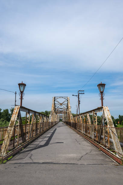 istock Iron massive pedestrian bridge leading straight into the distance 1574858796