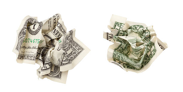 istock one crumpled dollar isolated on white with clipping path 157491240