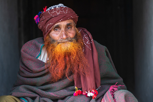 Khansahib Tehsil, Jammu and Kashmir, India. October 31, 2022. Man with a red henna dyed beard in a village in Jammu and Kashmir.