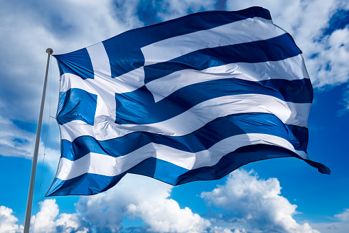 Greek flag waving in cloudy weather.