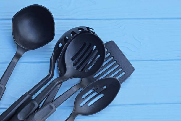 istock a heap of six black plastic kitchen utensils 1574999957