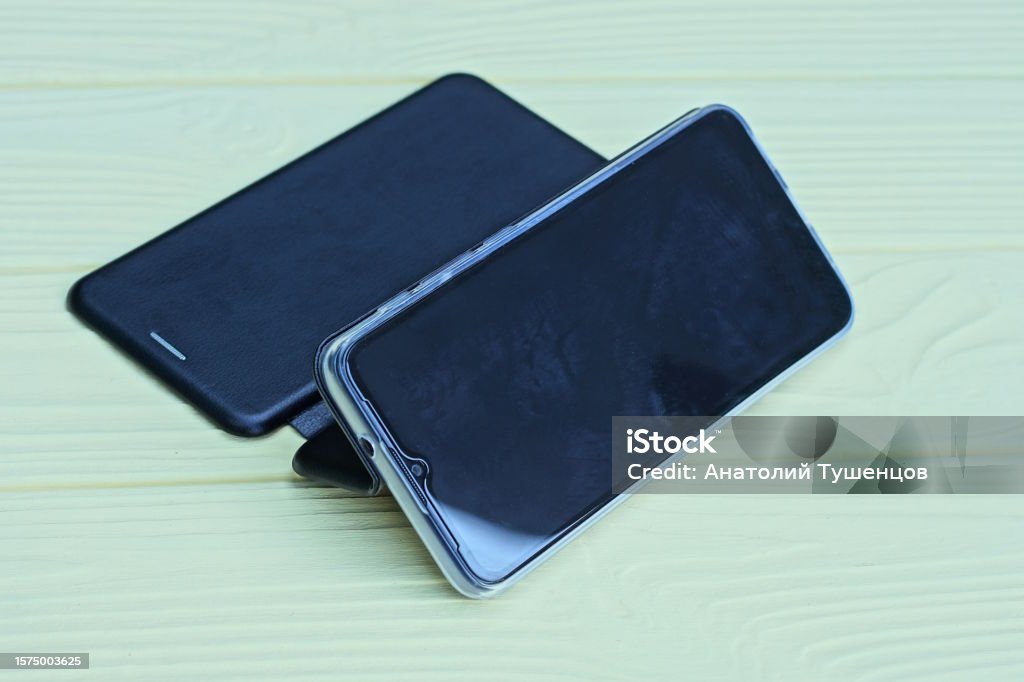 Rectangle Box Phone One Black Rectangular Telephone Smartphone In An Open Leather Case ...