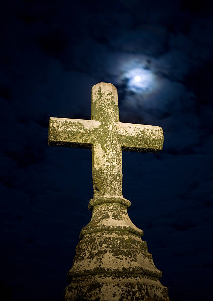 istock Cemetery Cross Stone with Full Moon and Dark Blue Clouds 157501748