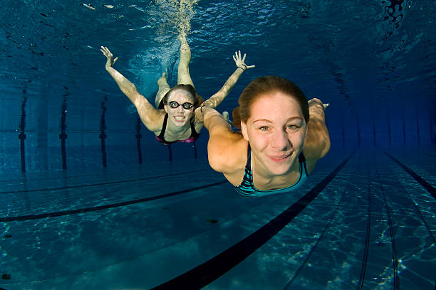 istock Teens enjoying underwater swimming 157501824