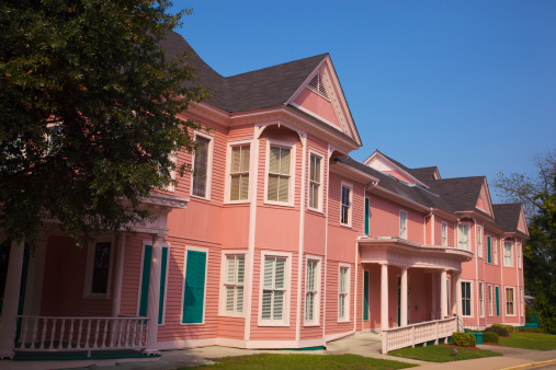 Pink building looks like senior assisted living apartments in Macon's restored downtown district in good conidition and wheelchair access to living quarters but is actually a historic office building with rental facilities for meetings, banquets, wedding receptions, etc