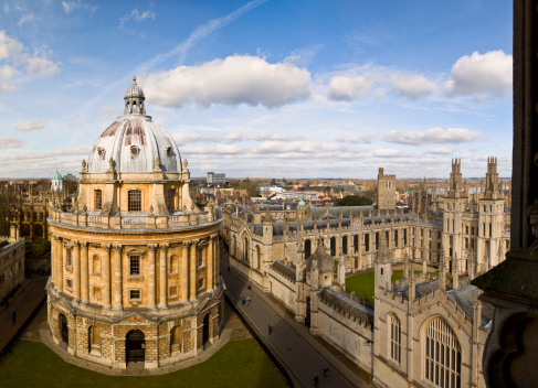 Oxford, UK - April 13, 2021: tourists in radcliffe Camera, bodleian library, oxford university, oxford, Oxfordshire, England, United Kingdom