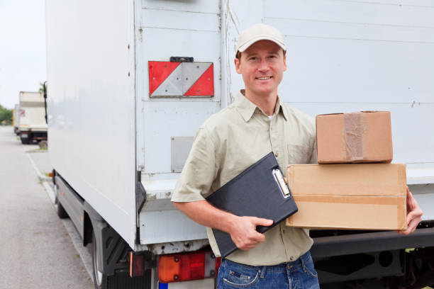istock delivery boy standing next to a truck 157502183