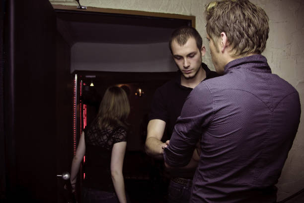 People Dancing in Nightclub and Young Woman DJ Performing.
