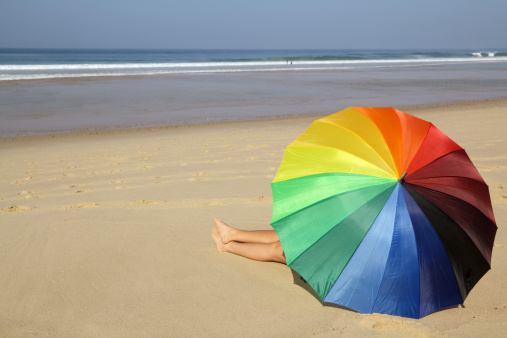 Empty beach with beach umbrella