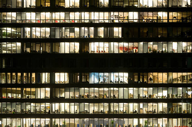 istock Working late in finance building 157502485