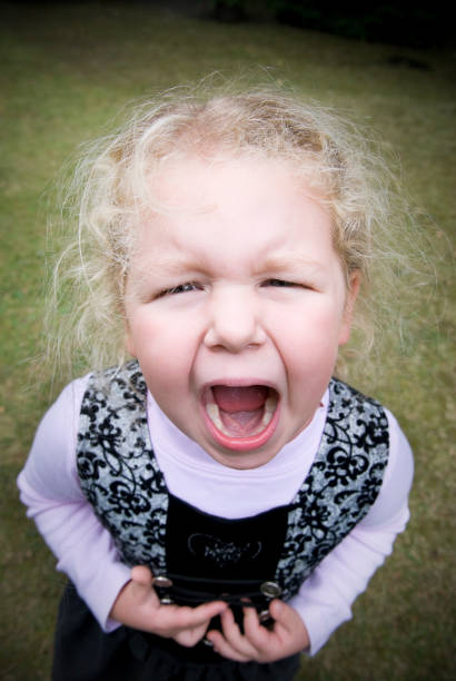 istock Small blonde girl crying, screaming, looking afraid 157502769