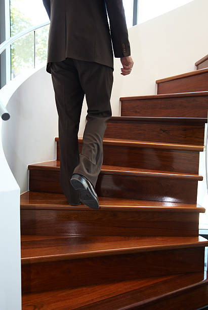 istock Businessman climbing a staircase 157502839