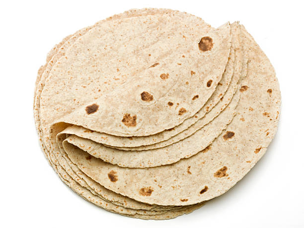 Lot of whole wheat flour mexican tortillas  tortilla flatbread stock pictures, royalty-free photos & images