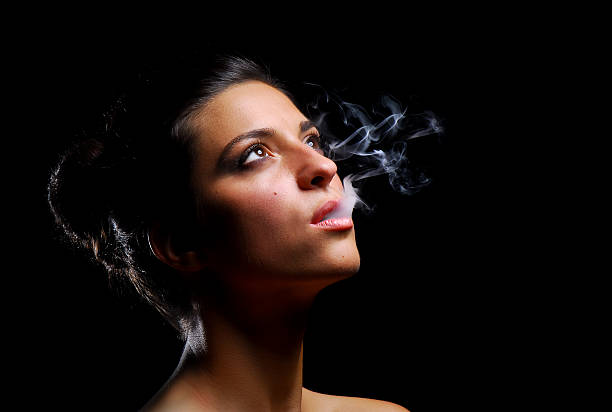 Smoking girl stock photo
