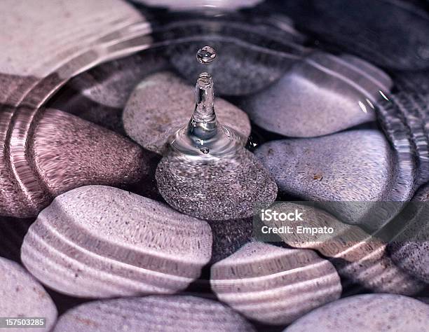 Water Droplet Over Pebbles Stock Photo - Download Image Now - Pebble, Water, Rippled