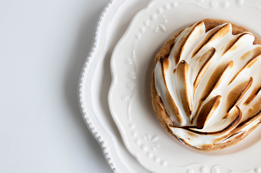 Delicious Lemon meringue pie on white background