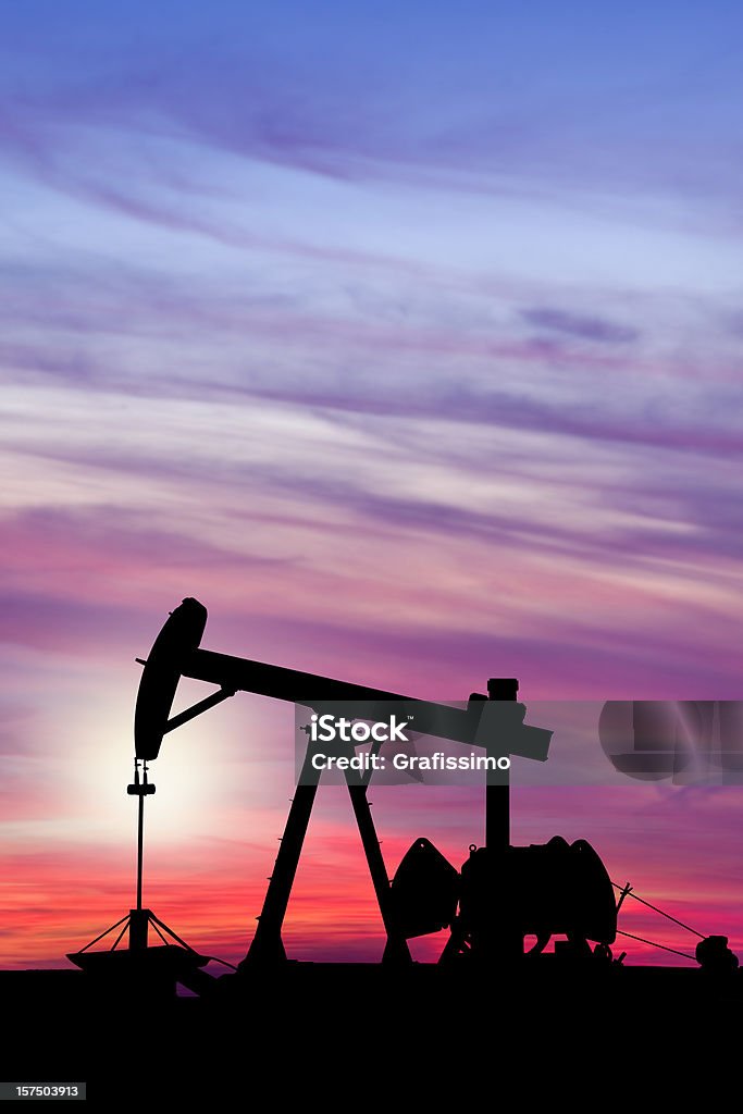 Dawn over petroleum pump in the desert http://farm2.static.flickr.com/1419/1104541569_ac9b7d72f2.jpg?v=0 Crude Oil Stock Photo