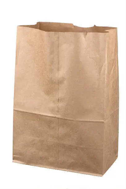 Isolated empty brown grocery bag on white background