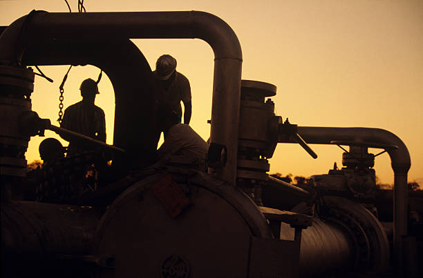 Workers at sunset stock photo