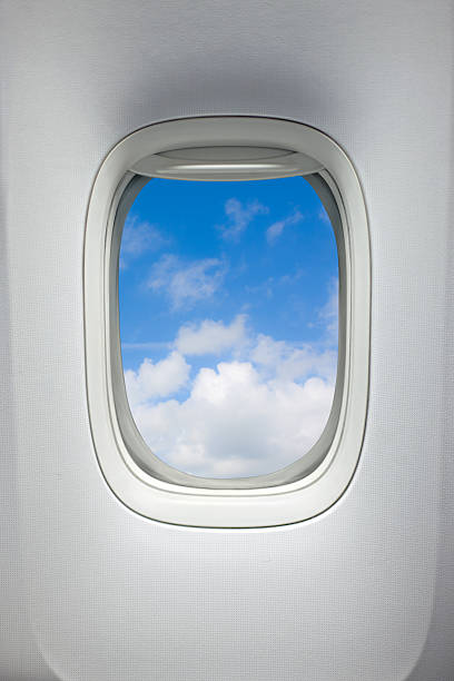 Airplane window (Clipping Path) Airplane window with a view of sky and clouds. With clipping path around the inside of the window. aeroplane isolated stock pictures, royalty-free photos & images
