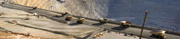 Photo of Large dump trucks in Utah copper mine