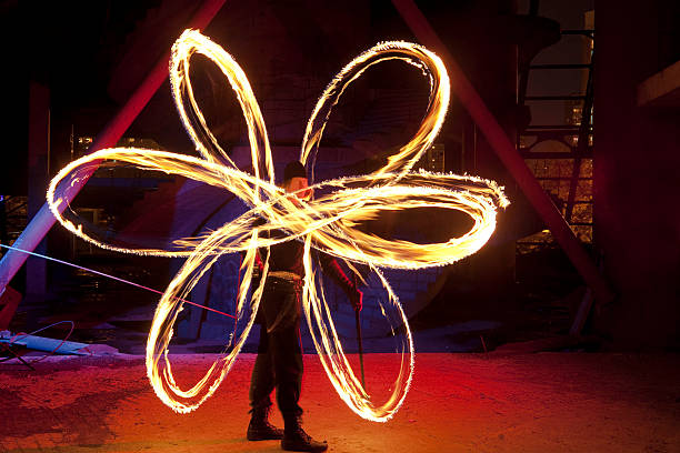 istock Fire poi dancer showing a flower 157505127