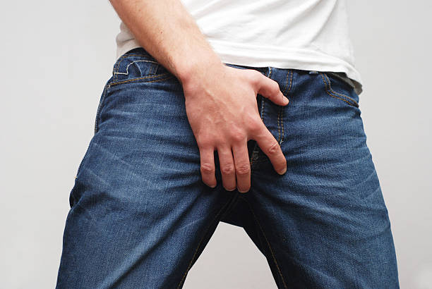 男性彼の ballbag scrotum 保護 - teenage sex ストックフォトと画像