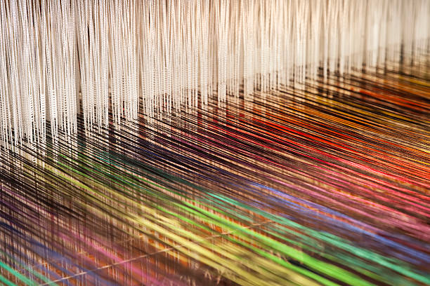 Close-up of a loom weaving colorful fabric (XXXL) Close-up of a loom weaving colorful fabric (XXXL) loom photos stock pictures, royalty-free photos & images