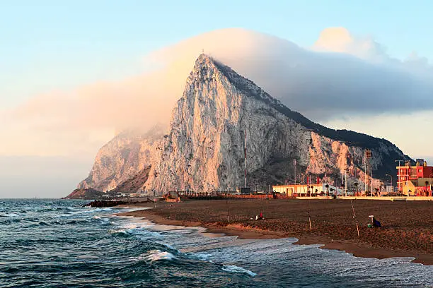 The rock of Gibraltar at sunrise as seen from the coast of Southern Spain.  
[url=http://www.istockphoto.com/my_lightbox_contents.php?lightboxID=1873311] View similar photos in my portfolio[/url]