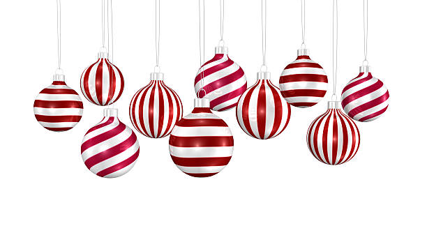 Hanging glossy red and white twisted striped Christmas ball. White shaded background. Christmas decoration, festive atmosphere concept.